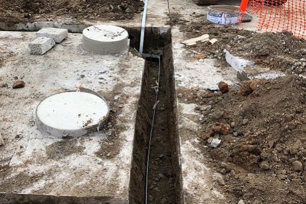 Construction site excavating and measuring